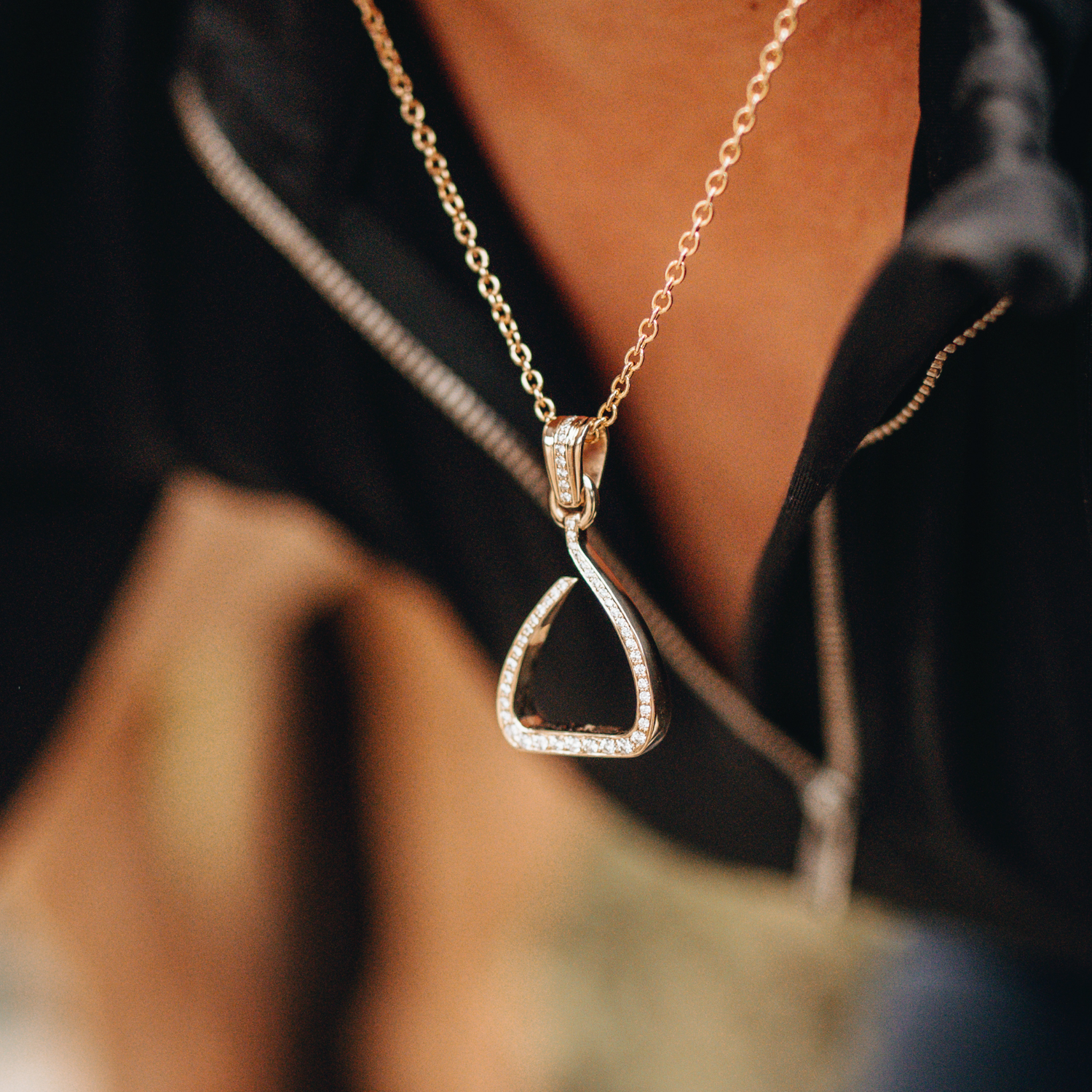 A photo of the original Jump pendant besigned by Kelly Crawford of Crawford Equestrian Jewellery. The design is based on the Freejump Stirrup System. 