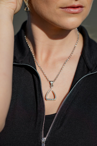 White gold Jump Stirrup Pendant, set with 1/2 carat of white brilliant cut diamonds. Paired beautifully with a white gold round belcher chain from Crawford Hill. 