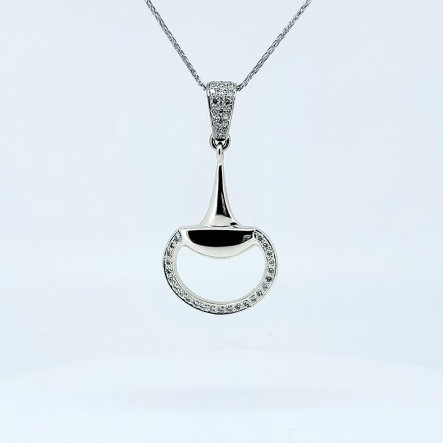 Product photo of Diamond set snaffle horse bit pendant in white gold by Crawford Hill Equestrian Jewellery.