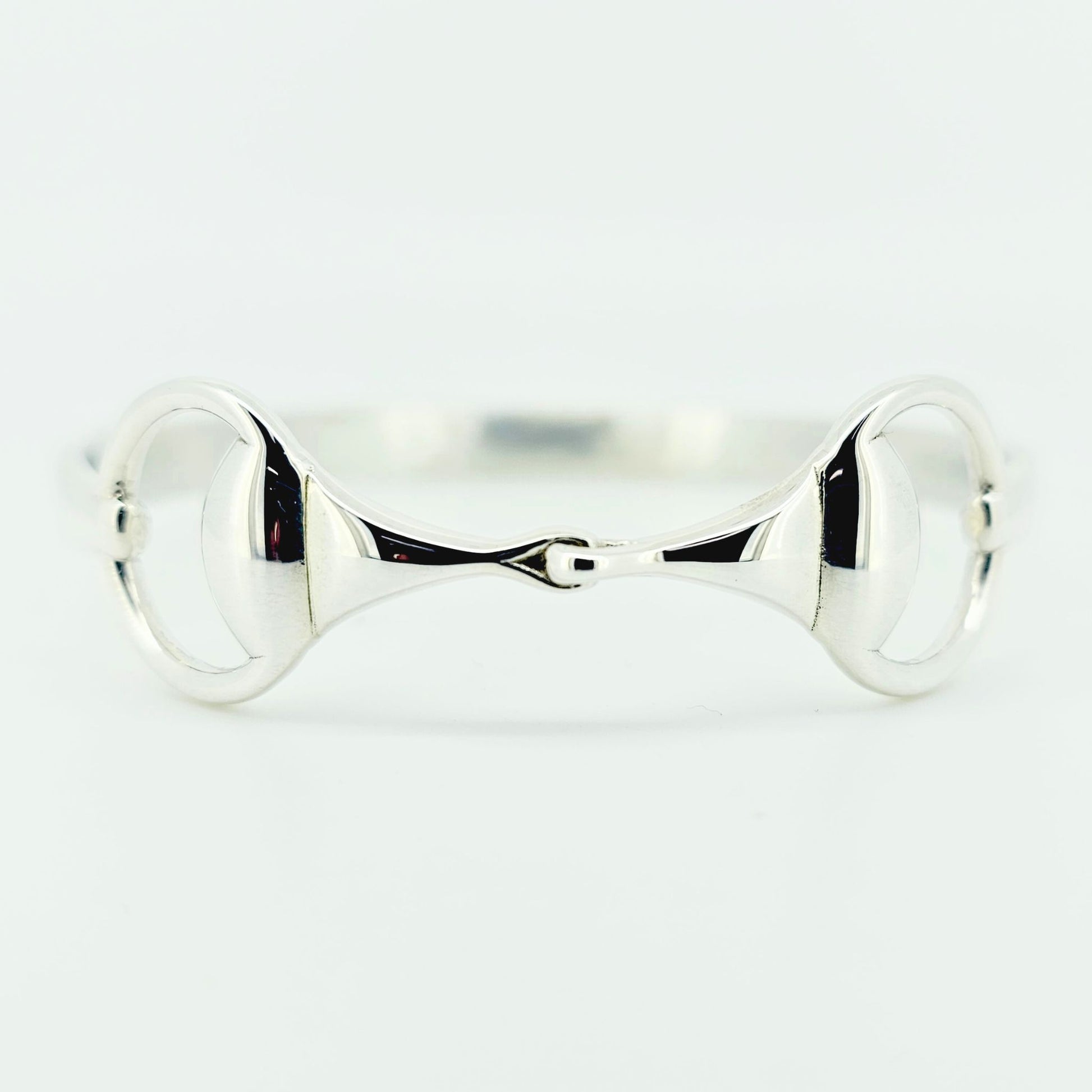 Product photo of horse bit snaffle bangle in sterling silver made by Crawford Hill Equestrian Jewellery. 