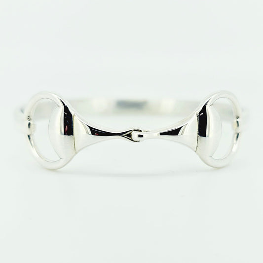 Product photo of horse bit snaffle bangle in sterling silver made by Crawford Hill Equestrian Jewellery. 