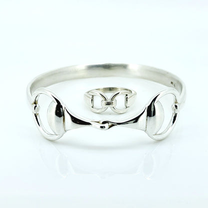 Photo of a silver horse bit snaffle bangle and ring, made by Crawford Hill Equestrian Jewellery. 