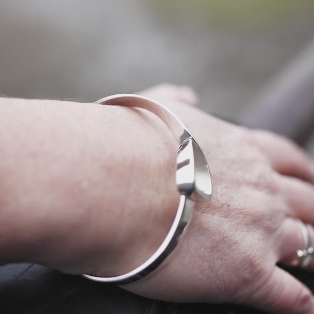 Equestrian horse rider wearing a Crawford Equestrian Jewellery Jump Stirrup Bangle, made in sterling silver. 