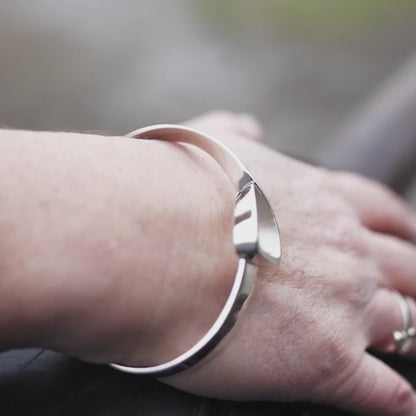 Equestrian horse rider wearing a Crawford Equestrian Jewellery Jump Stirrup Bangle, made in sterling silver. 