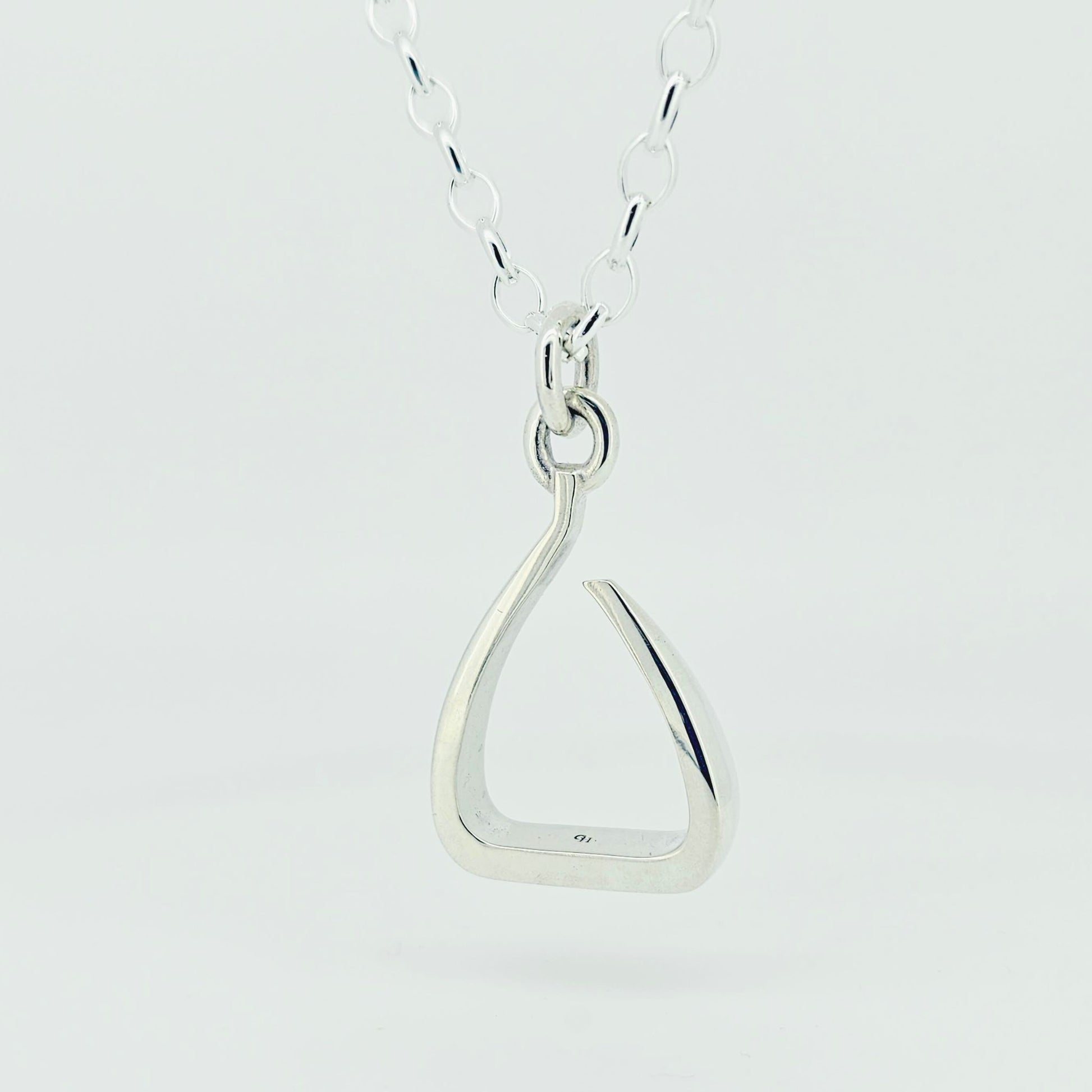 Silver jump stirrup necklace. Based on the Freejump Stirrup. Ring bale style. This is made for Horse riders and equestrians. Made by Crawford Hill Equestrian Jewellery.