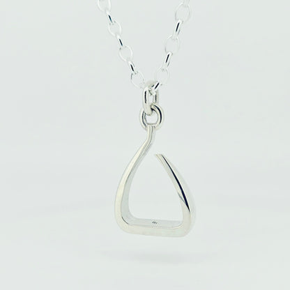 Silver jump stirrup necklace. Based on the Freejump Stirrup. Ring bale style. This is made for Horse riders and equestrians. Made by Crawford Hill Equestrian Jewellery.